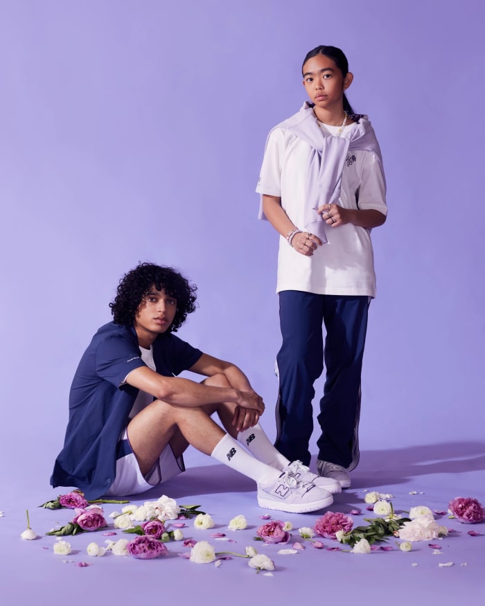 Models wearing blue and purple New Balance apparel.